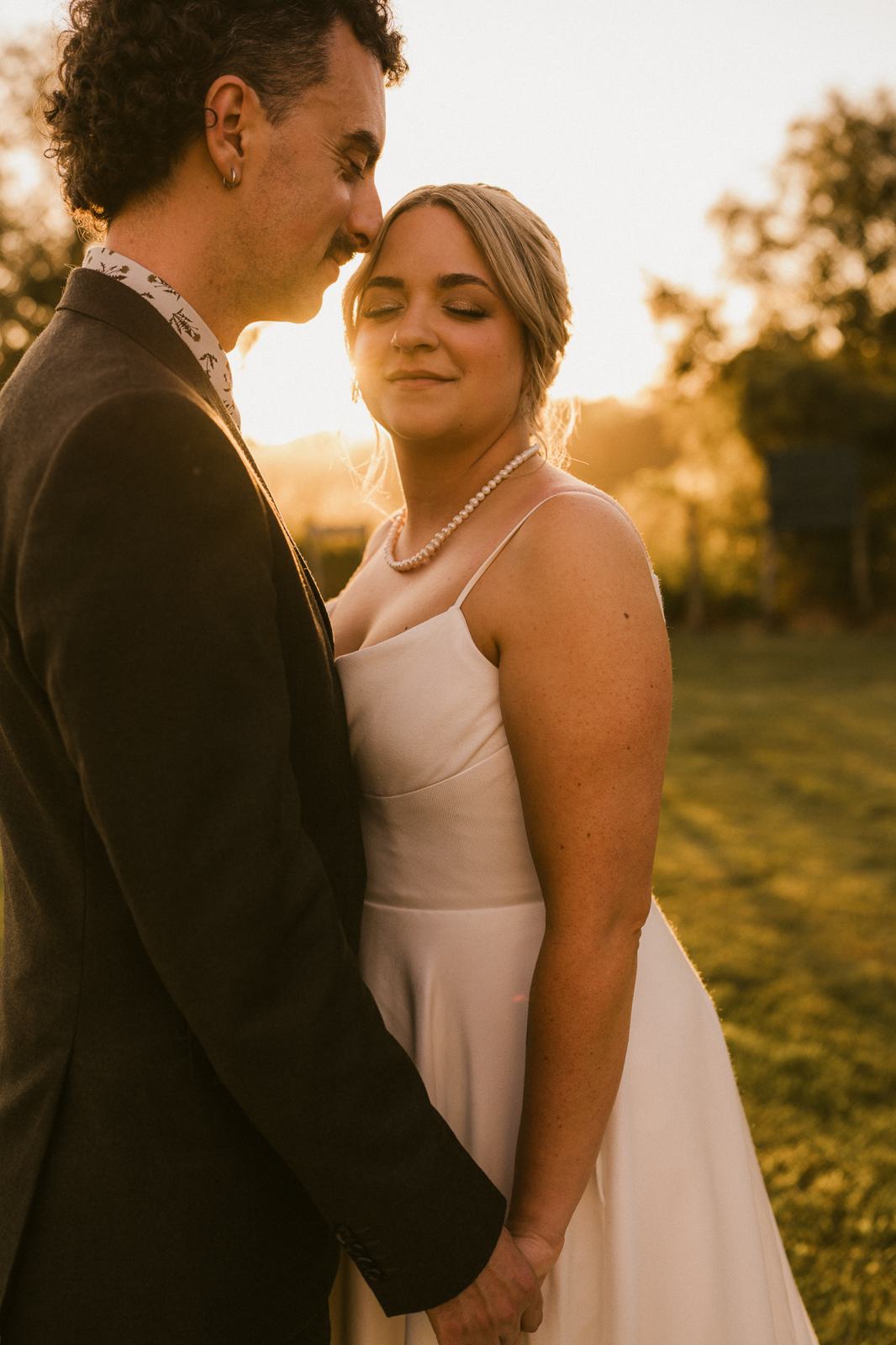 A couple embracing in warm evening light