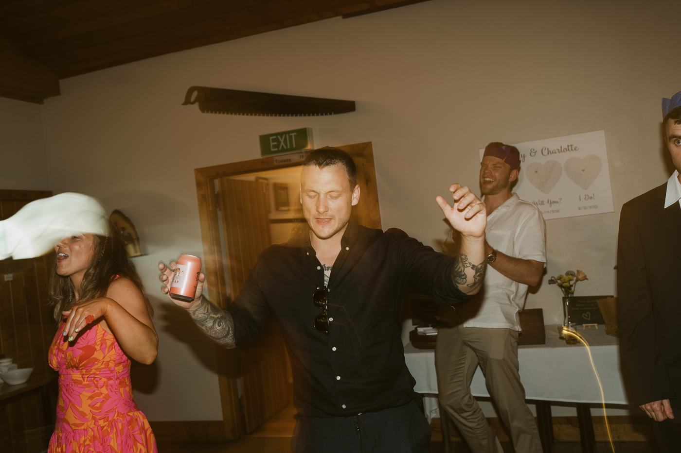 Guests dancing late in the evening in a farm hall