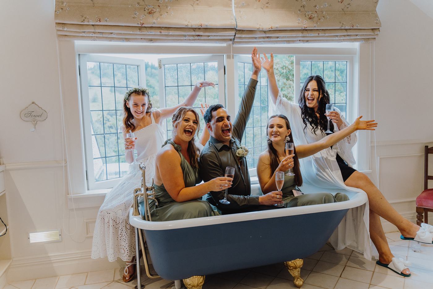 The bridal party piled into a clawfoot bathtub